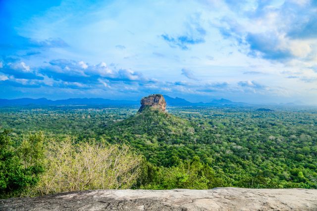 Sigiriya Sri Lanka, the ancient Lion Rock Fortress rising above lush green forests, featuring historic palace ruins and breathtaking panoramic views.